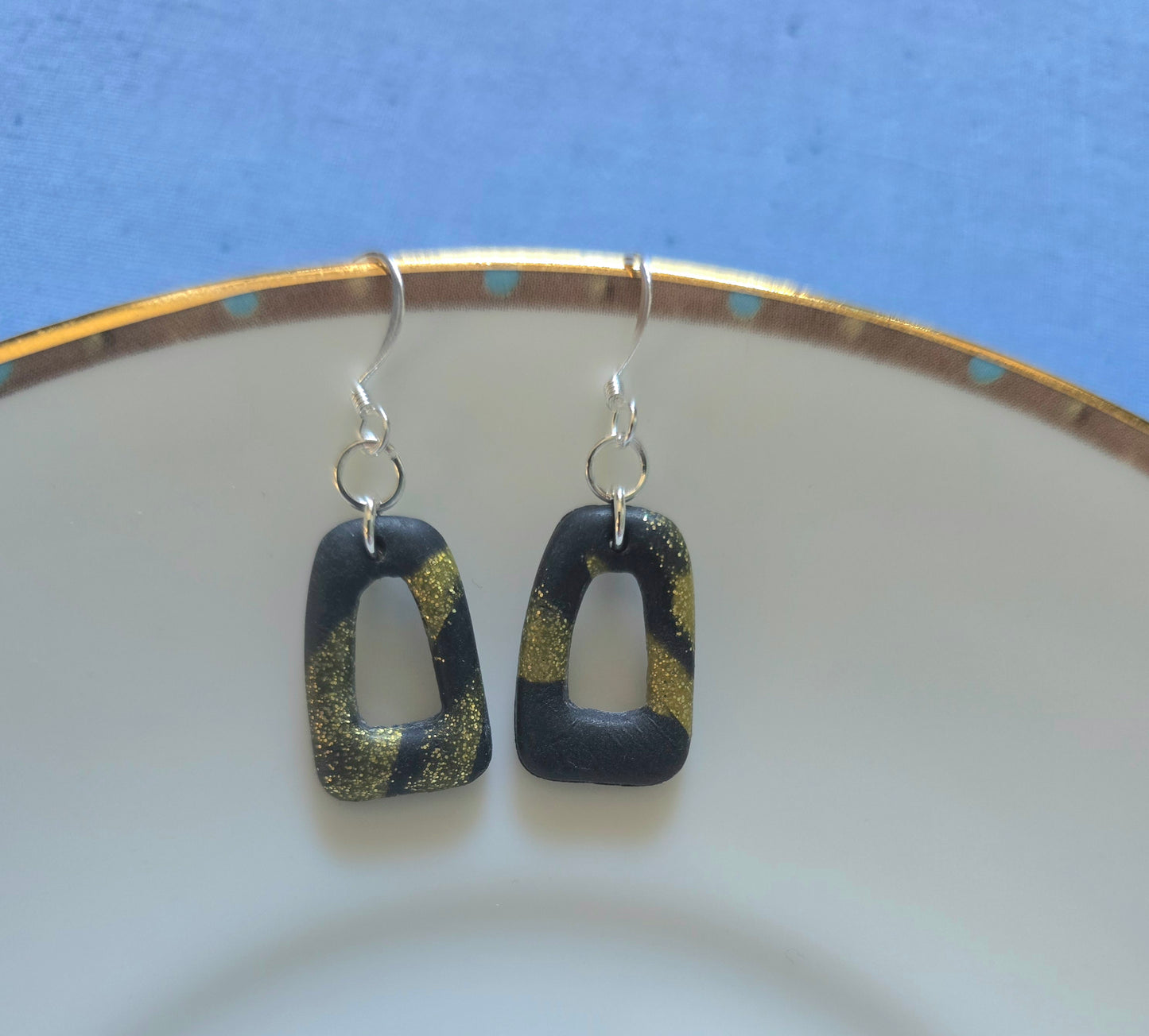 Black and gold dangle earrings