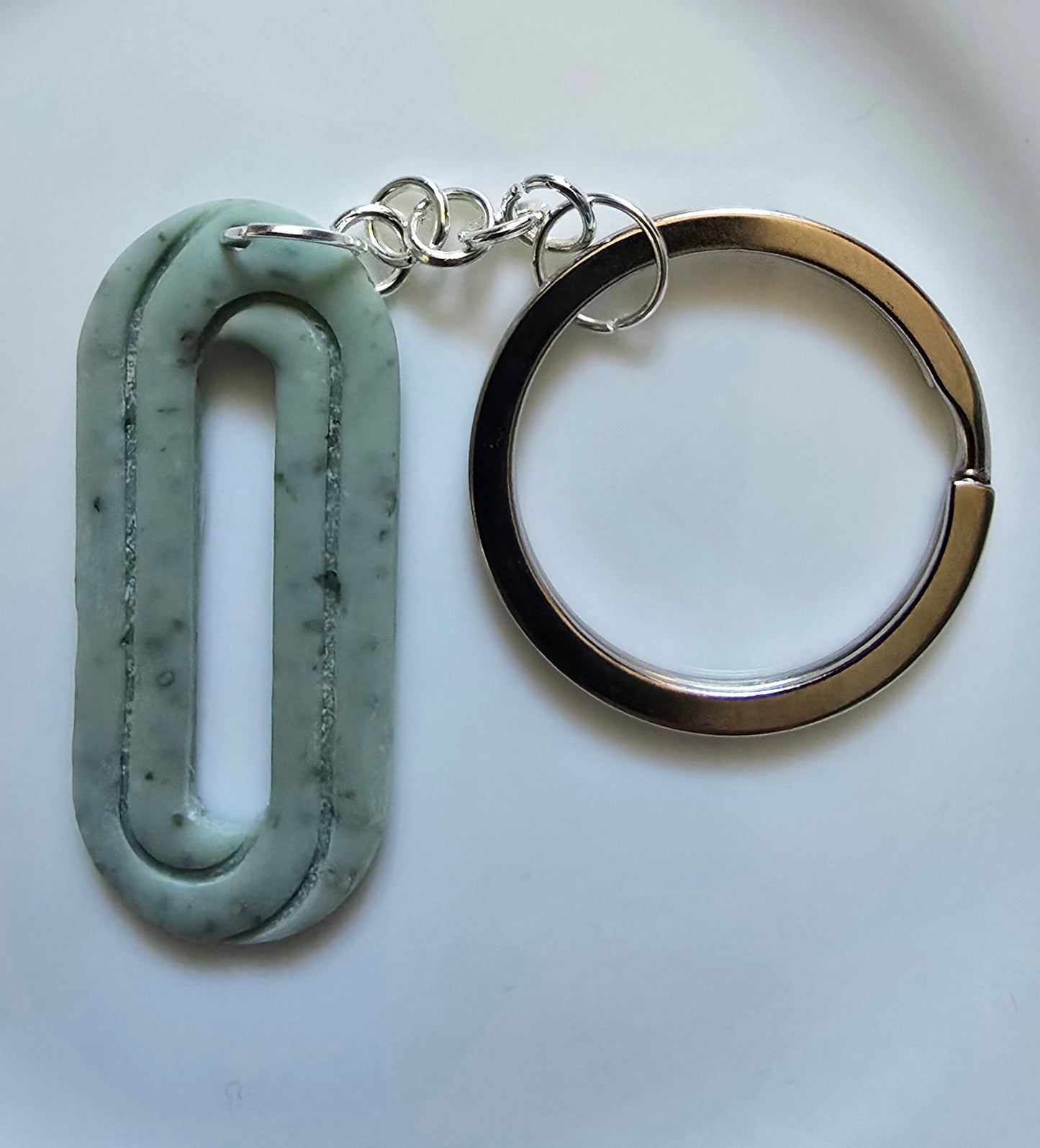 Oblong design pale green keyring